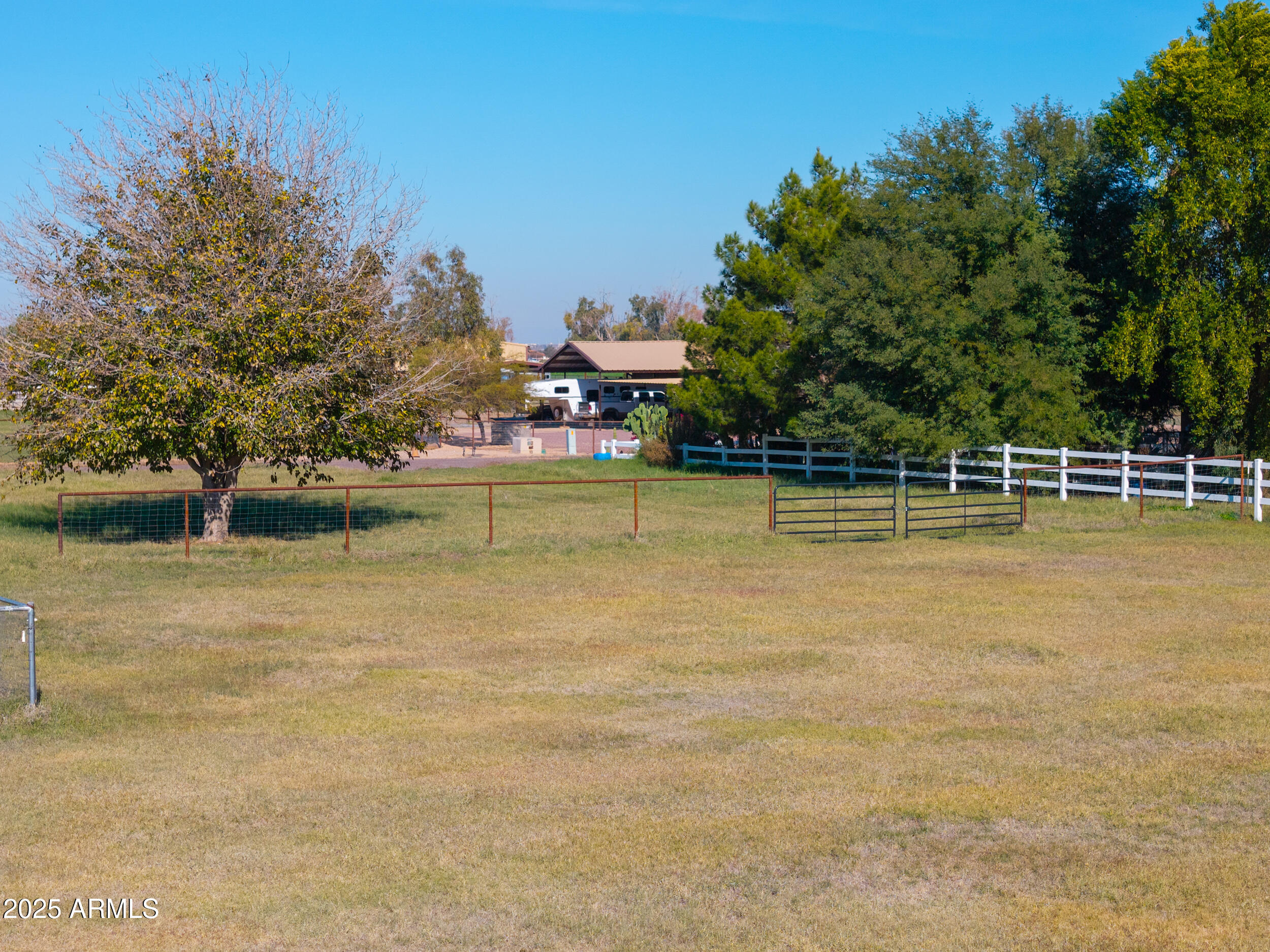 48217 West Quail Run Road, Unit 8 Maricopa, AZ 85139 - Photo 16 of 33 a view of a swimming pool with an outdoor space and seating area