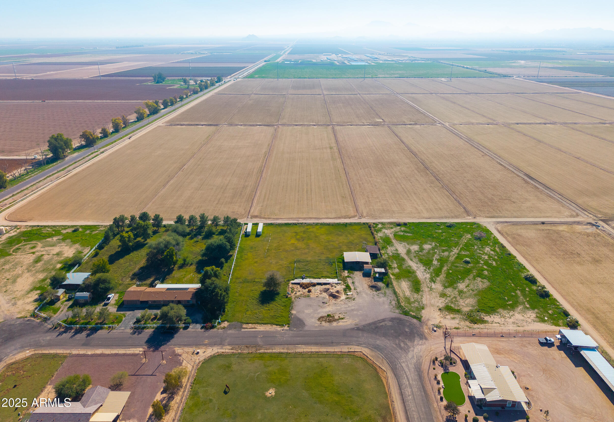 48217 West Quail Run Road, Unit 8 Maricopa, AZ 85139 - Photo 20 of 33 an aerial view of a house with a yard