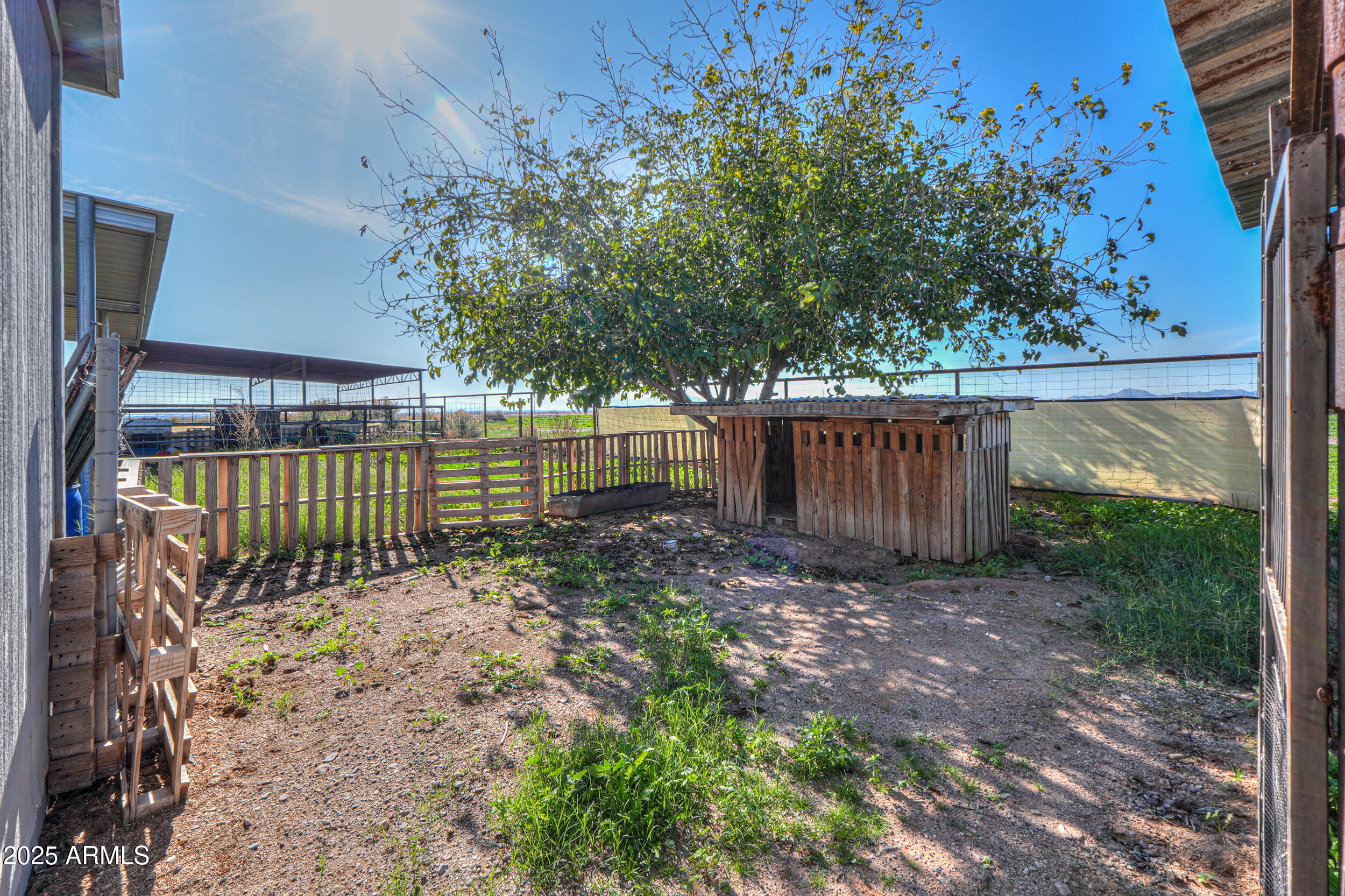 48217 West Quail Run Road, Unit 8 Maricopa, AZ 85139 - Photo 25 of 33 a view of outdoor space with deck and trees