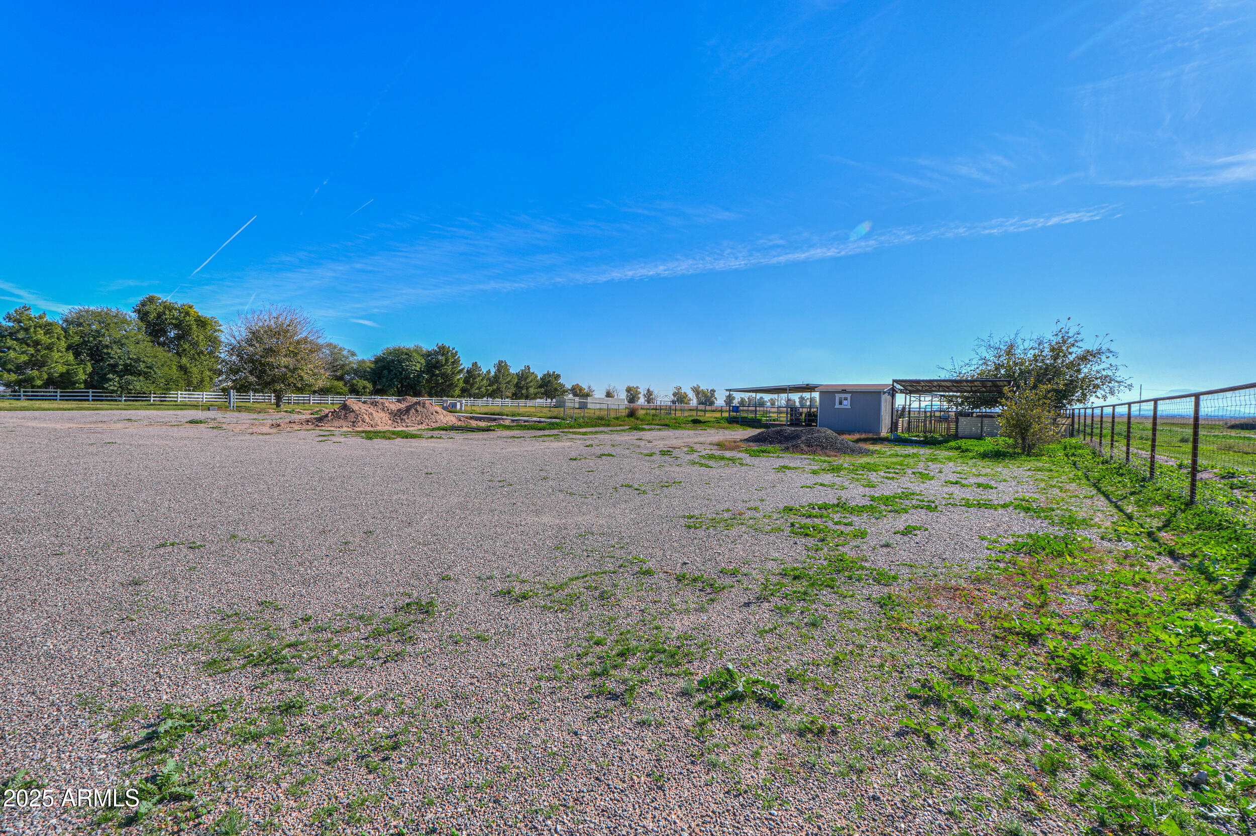 48217 West Quail Run Road, Unit 8 Maricopa, AZ 85139 - Photo 26 of 33 a view of a yard with an outdoor space
