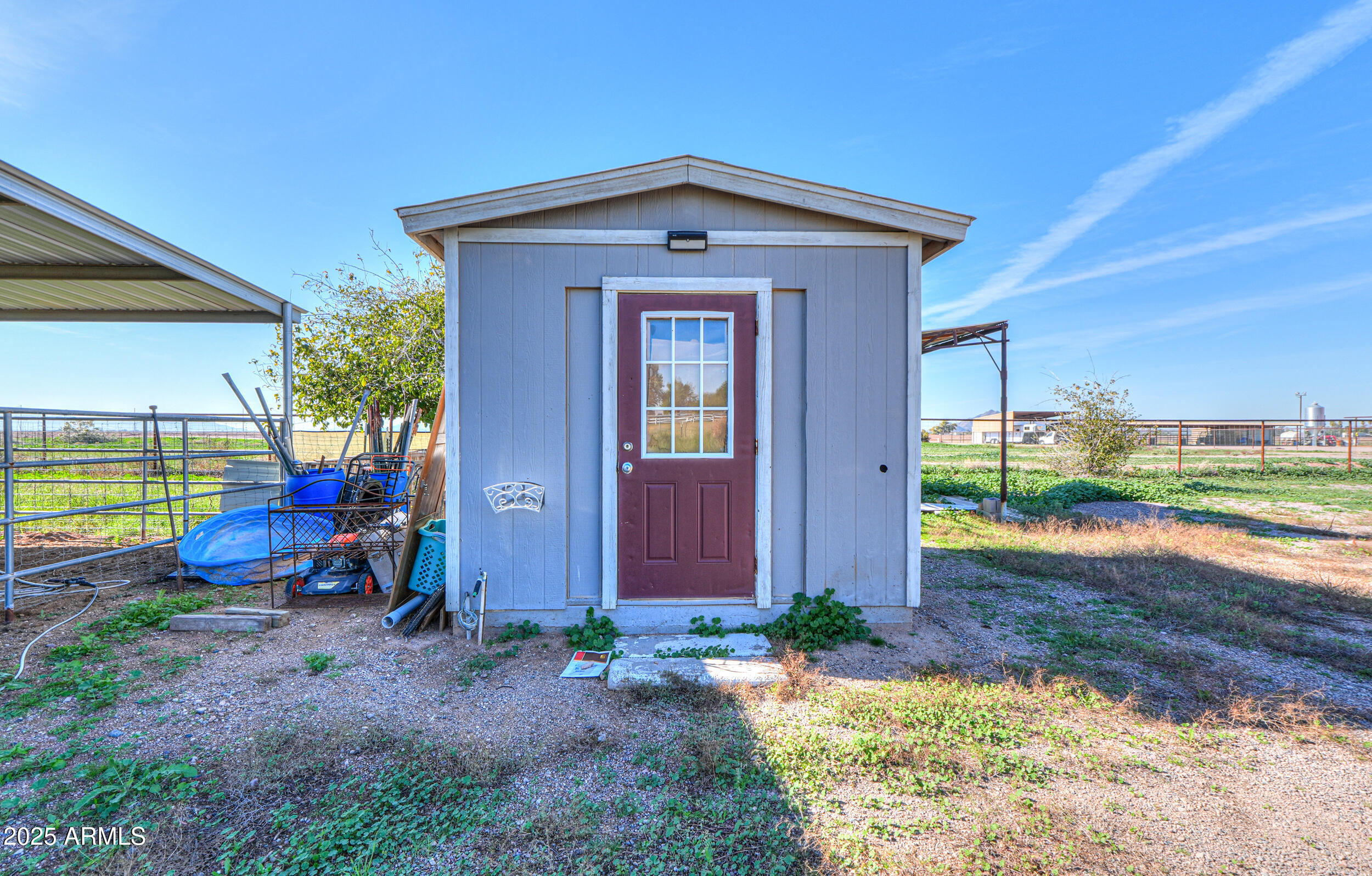 48217 West Quail Run Road, Unit 8 Maricopa, AZ 85139 - Photo 29 of 33 a view of a house with backyard and porch