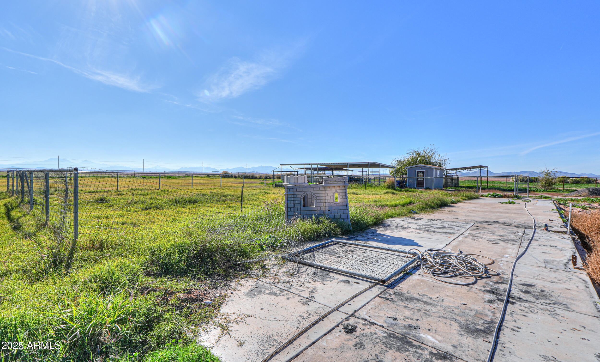 48217 West Quail Run Road, Unit 8 Maricopa, AZ 85139 - Photo 32 of 33 a view of a yard with an ocean view