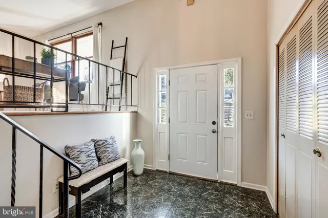 a kitchen with stainless steel appliances granite countertop a stove a sink dishwasher a refrigerator and a microwave oven with wooden floor