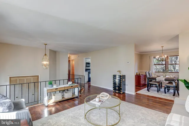 a view of a workspace with furniture and a table