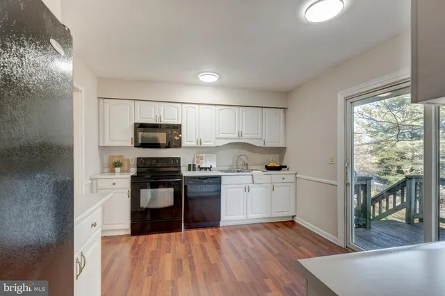 a living room with furniture and large windows