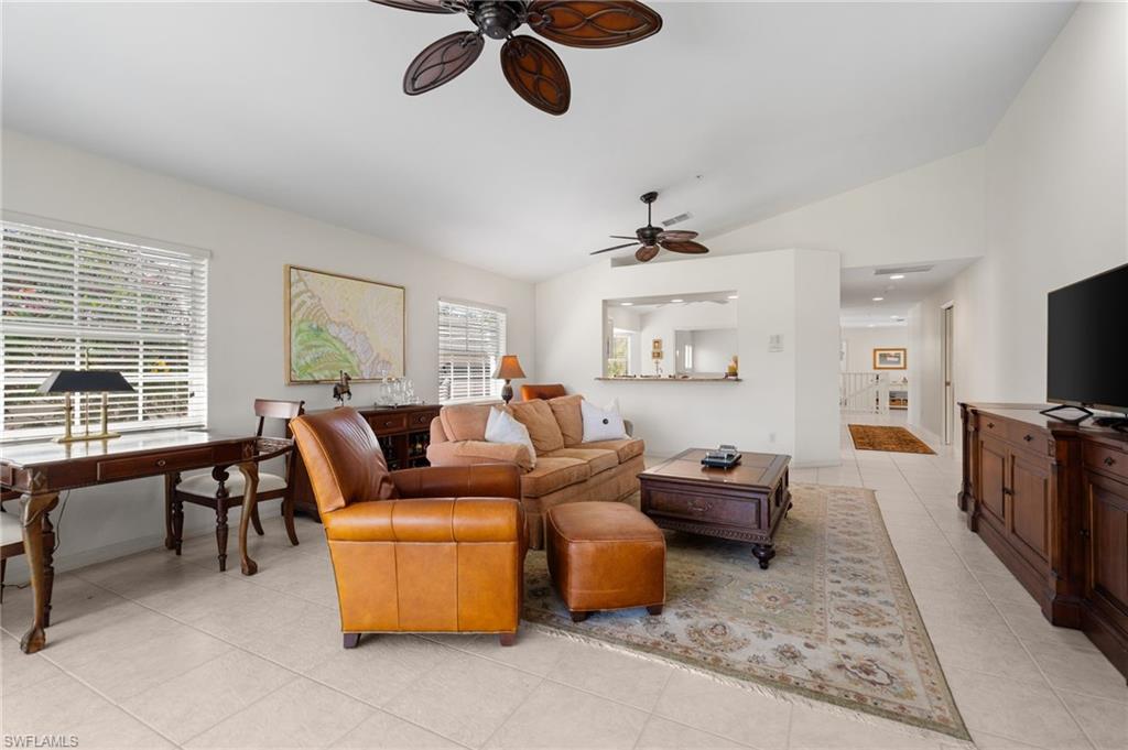 8500 Mystic Greens Way, Unit 506 Naples, FL 34113 - Photo 14 of 48 a living room with furniture and a flat screen tv