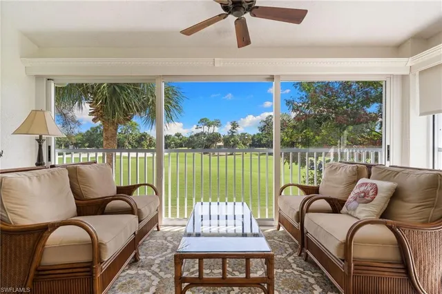 a view of a living room and dining room