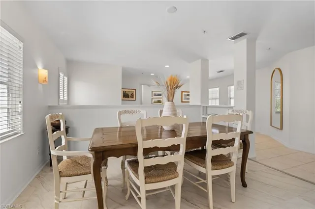 a spacious bathroom with a granite countertop tub sink and mirror