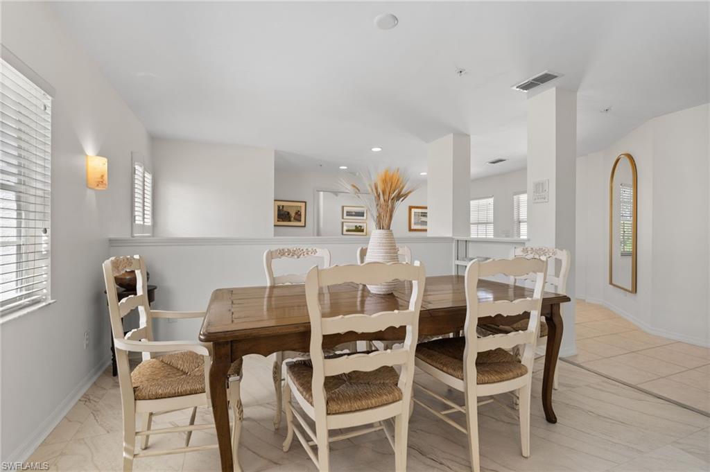 8500 Mystic Greens Way, Unit 506 Naples, FL 34113 - Photo 27 of 48 a dining room with furniture and window