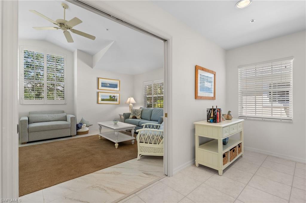 8500 Mystic Greens Way, Unit 506 Naples, FL 34113 - Photo 32 of 48 a living room with furniture and a window