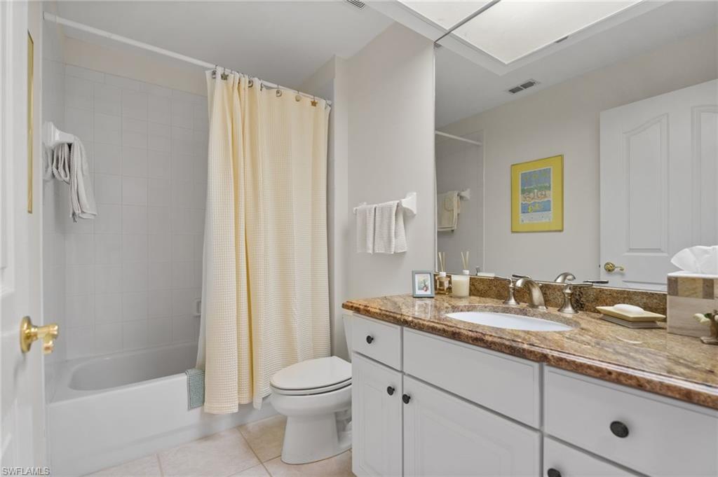 8500 Mystic Greens Way, Unit 506 Naples, FL 34113 - Photo 37 of 48 a bathroom with a granite countertop sink toilet and shower