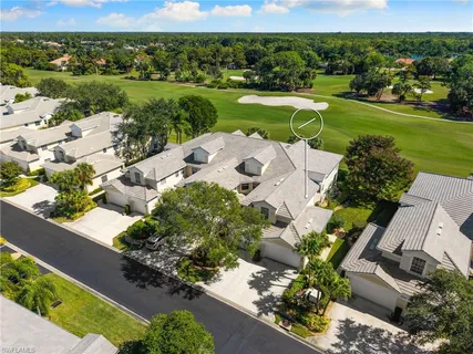 an aerial view of a house with a lake view