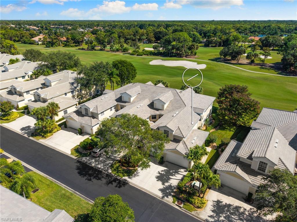 8500 Mystic Greens Way, Unit 506 Naples, FL 34113 - Photo 40 of 48 an aerial view of a house with a garden