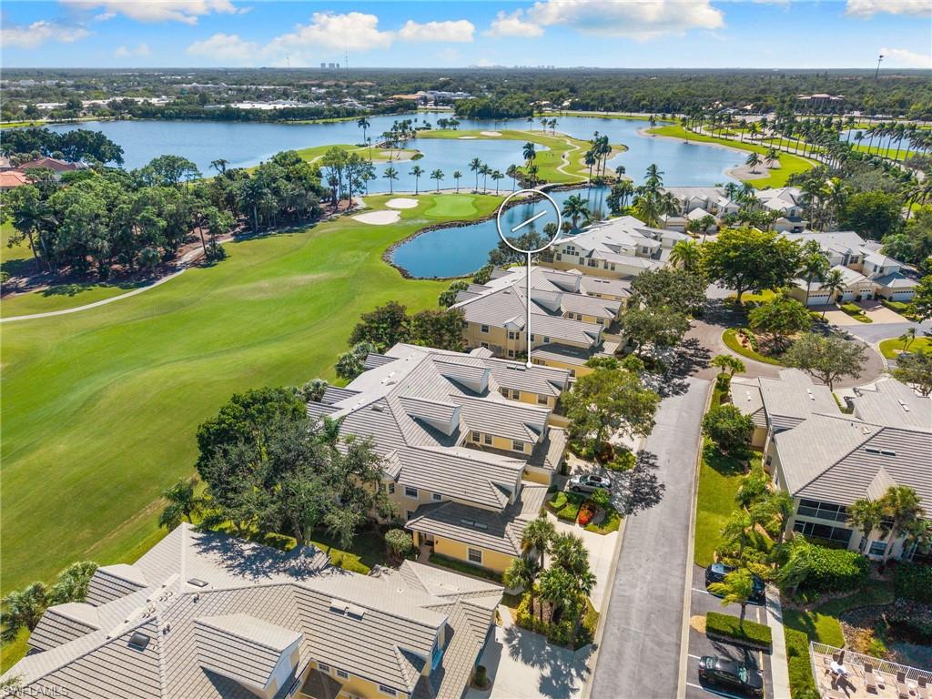 8500 Mystic Greens Way, Unit 506 Naples, FL 34113 - Photo 41 of 48 aerial view of a city with lots of residential buildings ocean and mountain view in back