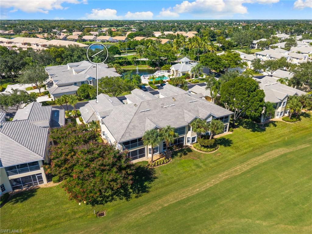 8500 Mystic Greens Way, Unit 506 Naples, FL 34113 - Photo 42 of 48 an aerial view of residential houses with outdoor space and river
