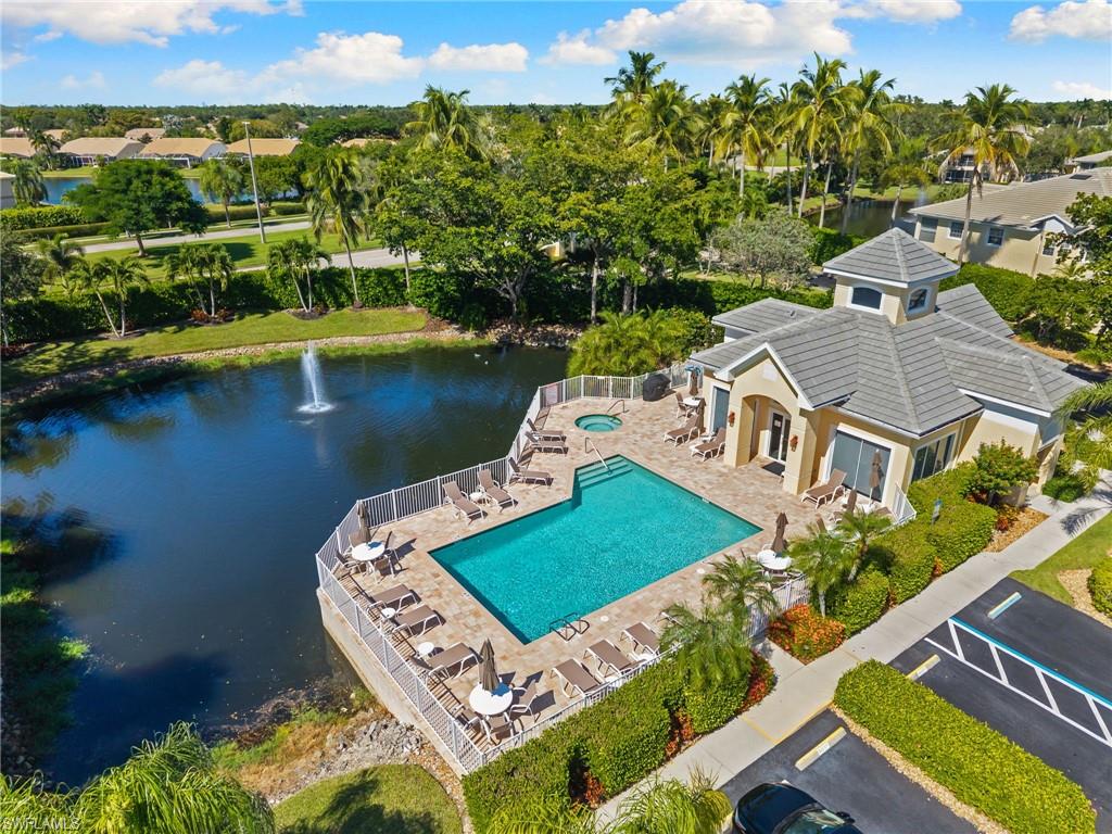 8500 Mystic Greens Way, Unit 506 Naples, FL 34113 - Photo 43 of 48 an aerial view of a house with a lake view