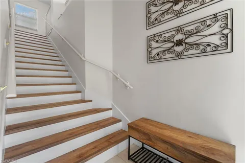 a view of entryway with white walls and chandelier