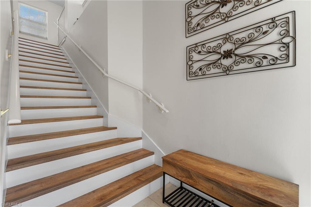 8500 Mystic Greens Way, Unit 506 Naples, FL 34113 - Photo 8 of 48 a view of wooden floor with a rug