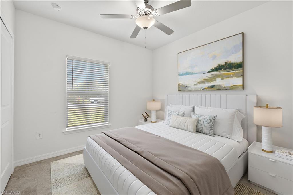 858 Rue Labeau Circle Fort Myers, FL 33913 - Photo 11 of 19 Bedroom with ceiling fan and light tile floors