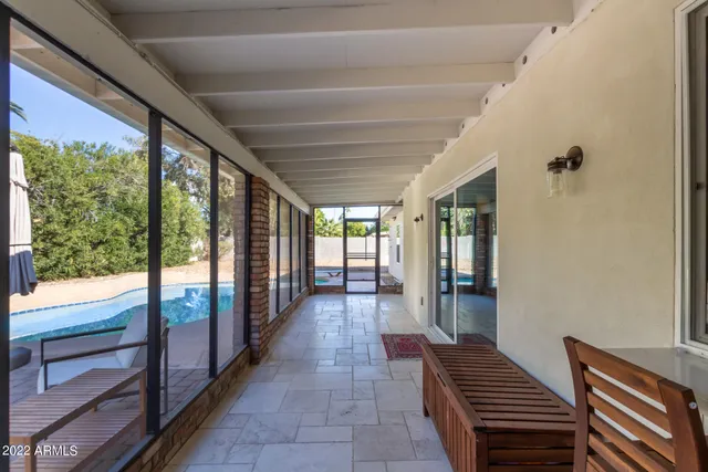 a view of a swimming pool with a yard