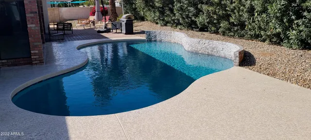 a view of swimming pool outdoor seating