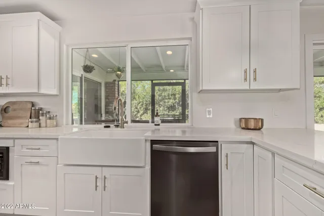 a kitchen with appliances cabinets and a sink