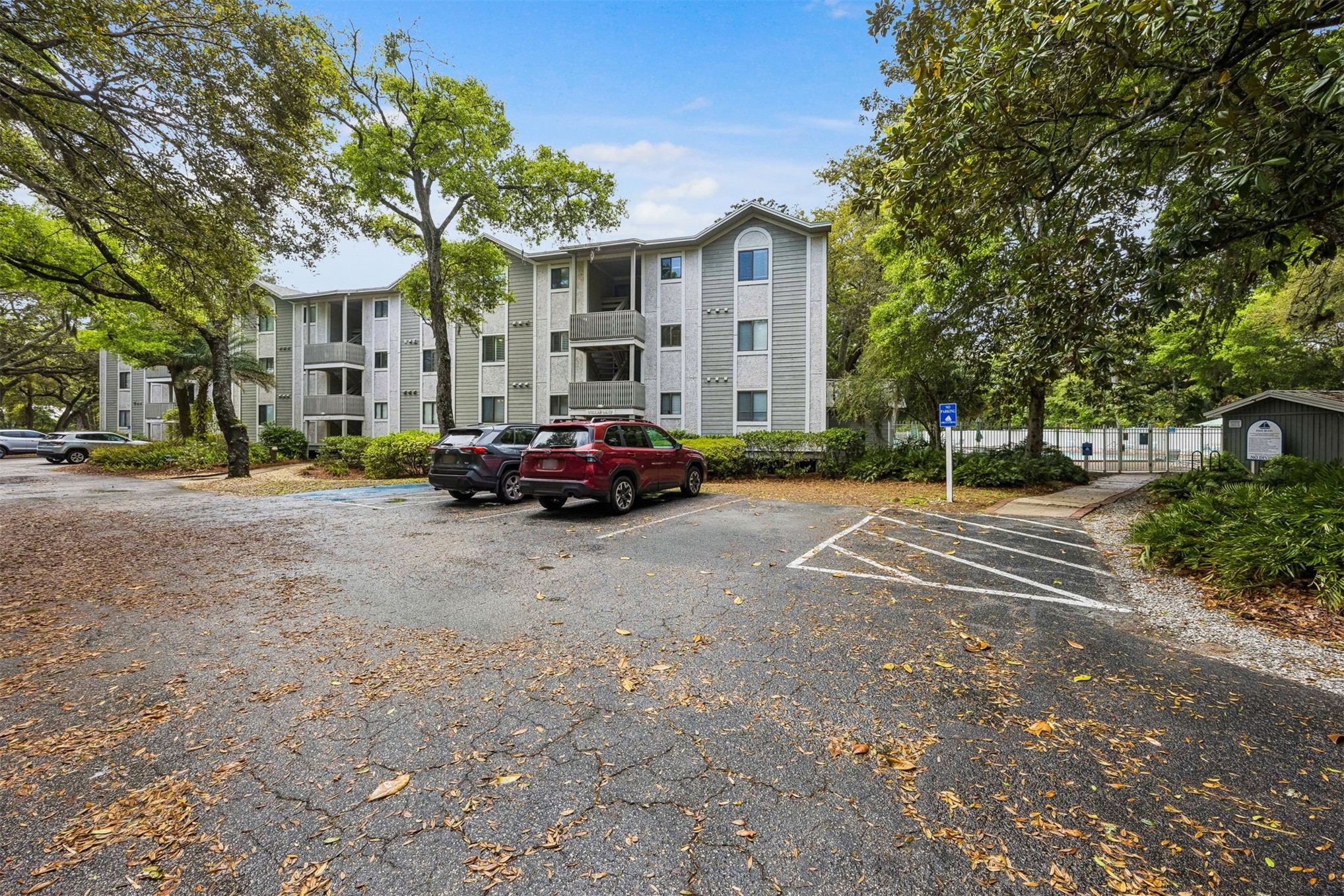 2328 Sadler Road, Unit 1C Fernandina Beach, FL 32034 - Photo 3 of 49 a car parked in front of a building