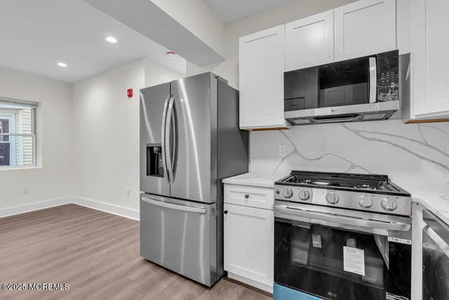 a kitchen with a stove and a microwave