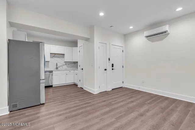 a view of kitchen with wooden floor