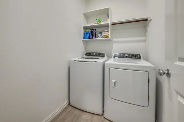 a view of a dining room with furniture and a potted plant