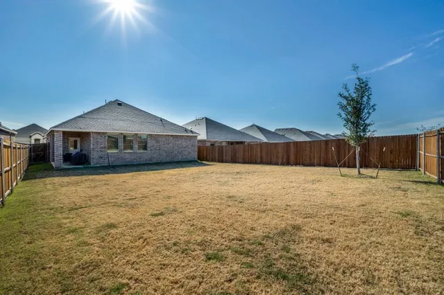 a view of swimming pool with a yard