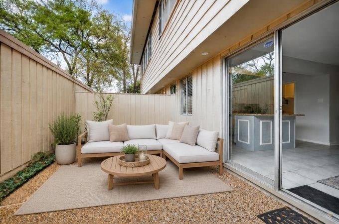 6404 Burgoyne Road, Unit 159 Houston, TX 77057 - Photo 19 of 38 Charming outdoor patio perfect for relaxation, with direct access to the interior through sliding glass doors - Virtually Staged
