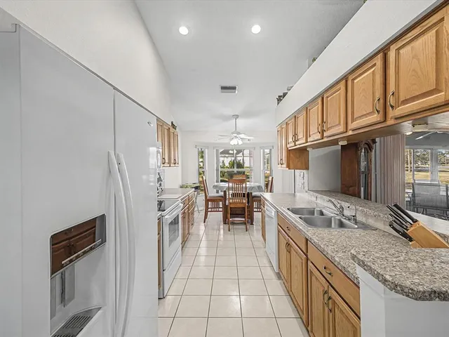 a kitchen with a stove top oven and sink