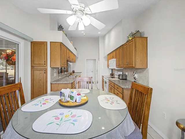 a kitchen with granite countertop a sink and cabinets