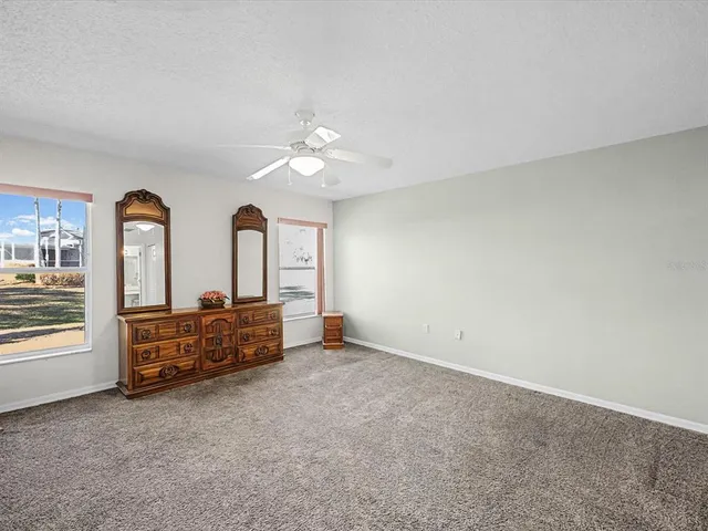 a spacious bathroom with a sink and a mirror