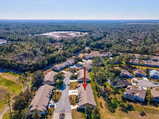 an aerial view of residential building and ocean