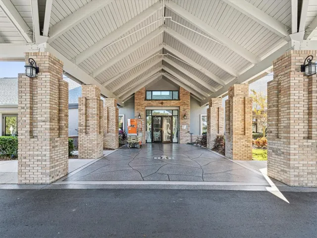 a living room with lots of furniture and a large window