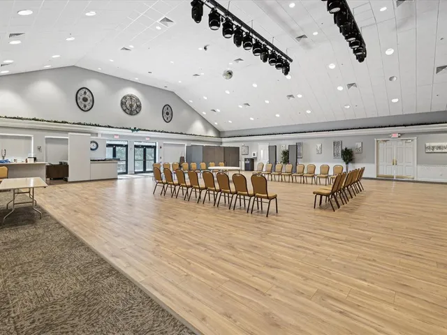 a room with furniture and pool table