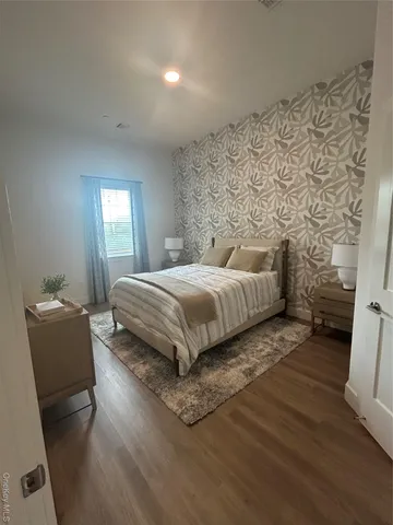 a bedroom with a bed and a couch
