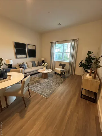 a kitchen with kitchen island a dining table and chairs