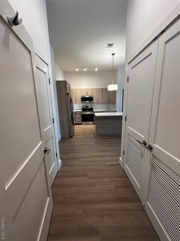 a view of a kitchen from the hallway