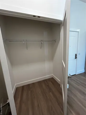 a view of an empty walk in closet