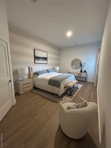 a bedroom with bed and window