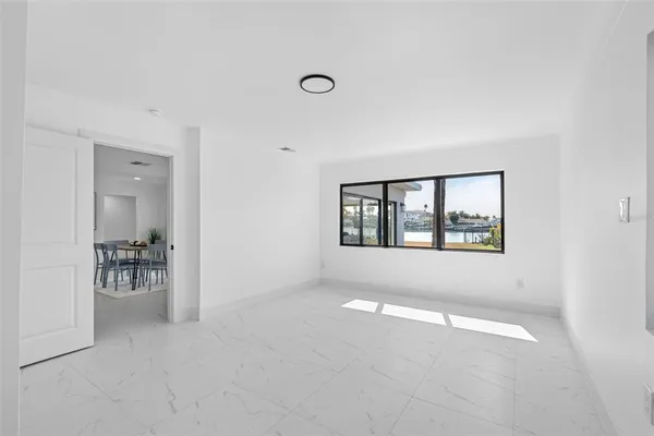 a view of livingroom with furniture and a window