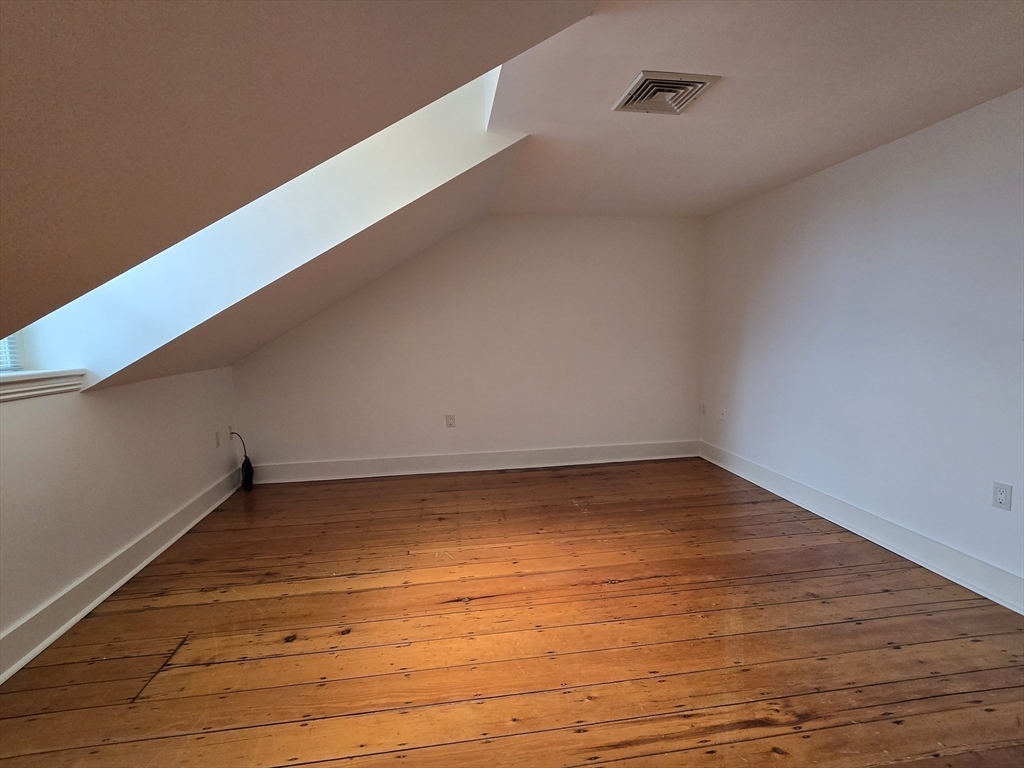 61 Otis Street, Unit 3 Cambridge, MA 02141 - Photo 8 of 18 a view of an empty room