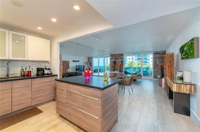 a kitchen that has a lot of cabinets a sink and a stove in it