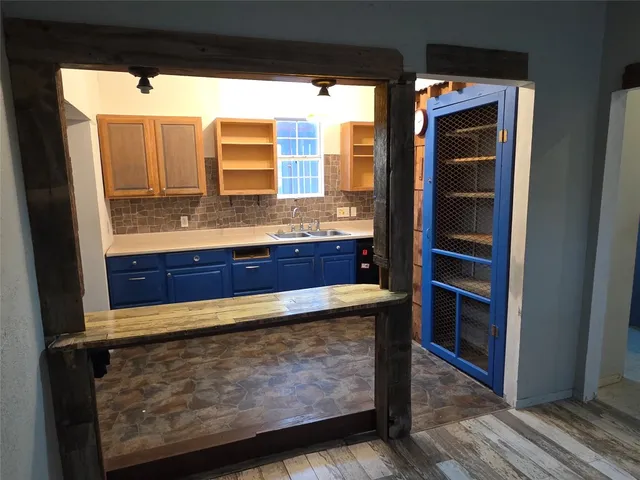 a view of room with window and wooden floor