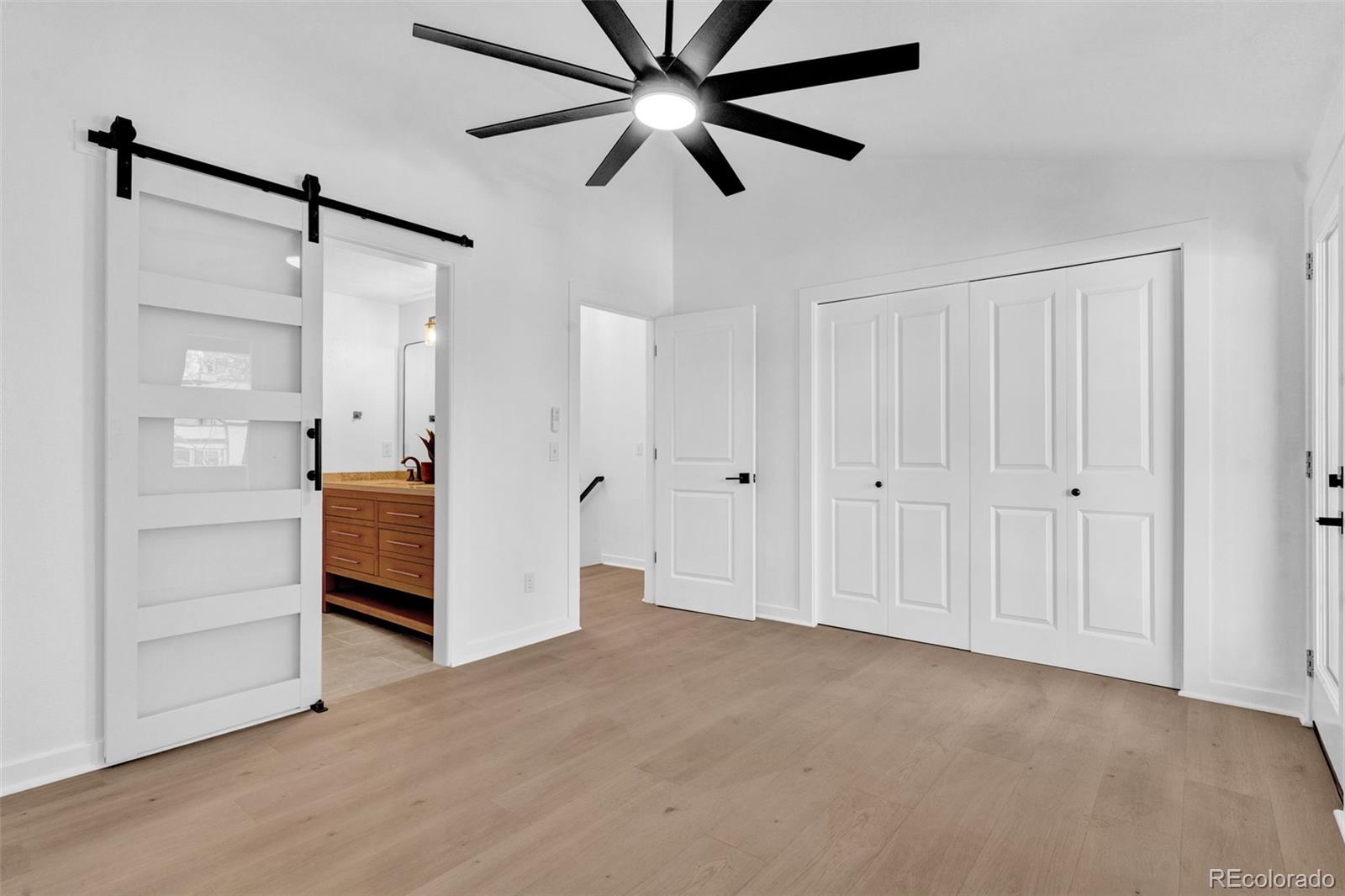 5051 Garrison Street, Unit 7C Wheat Ridge, CO 80033 - Photo 11 of 27 a view of empty room with cabinet and ceiling fan