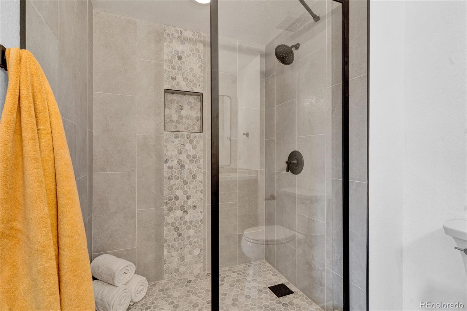 5051 Garrison Street, Unit 7C Wheat Ridge, CO 80033 - Photo 14 of 27 a bathroom with a shower