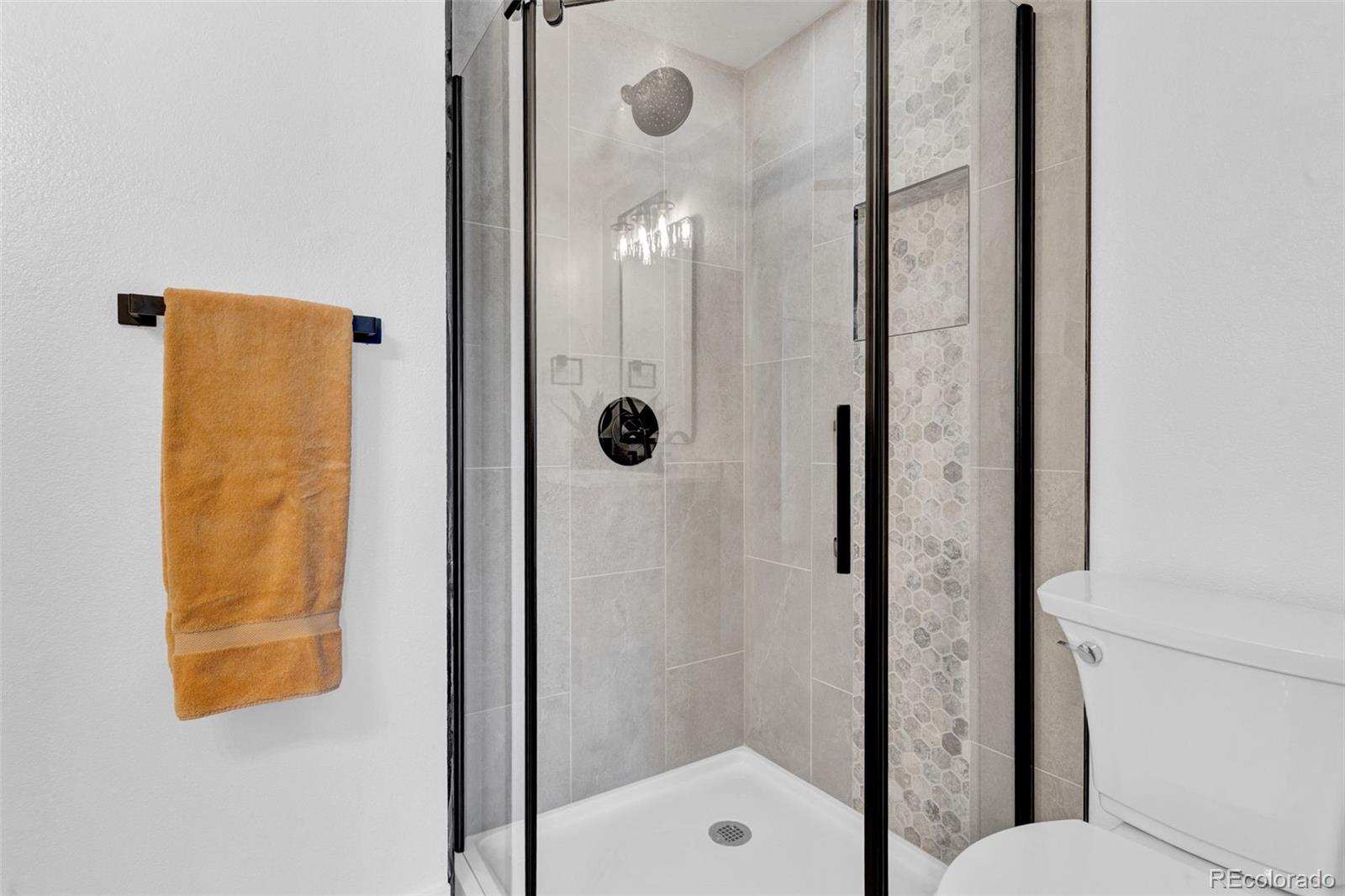 5051 Garrison Street, Unit 7C Wheat Ridge, CO 80033 - Photo 17 of 27 a bathroom with a shower